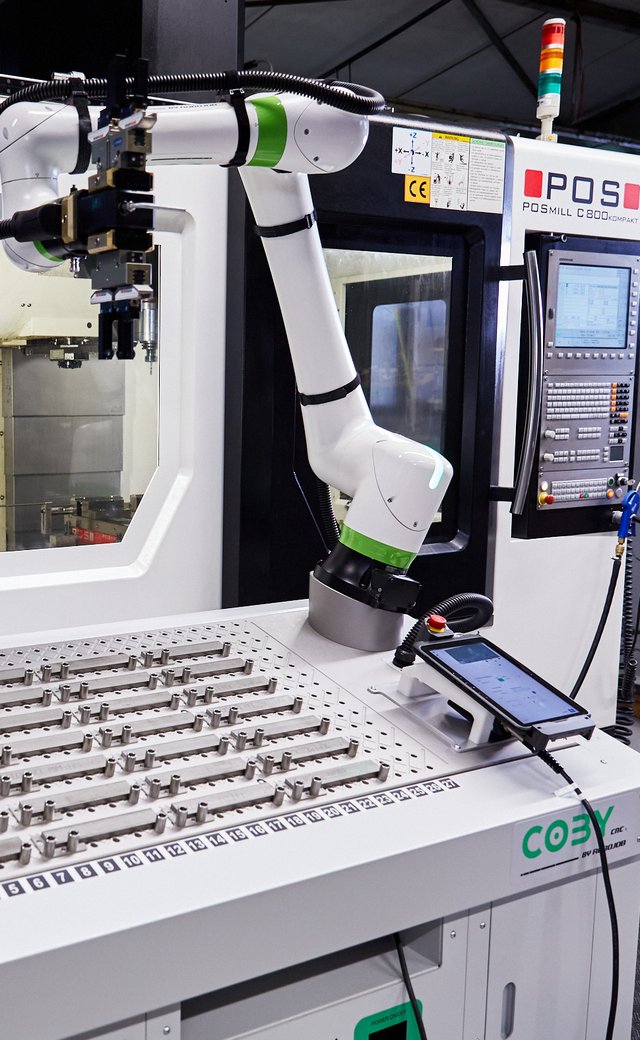 Coby at a POS CNC machine