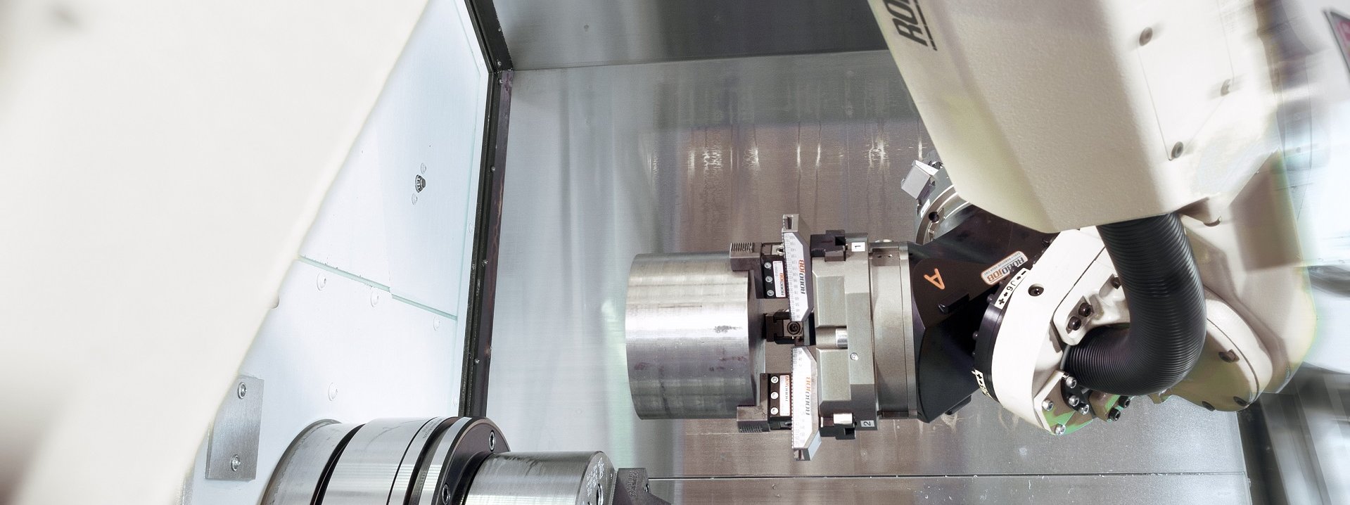 a robojob cnc automation system loading a cnc machine