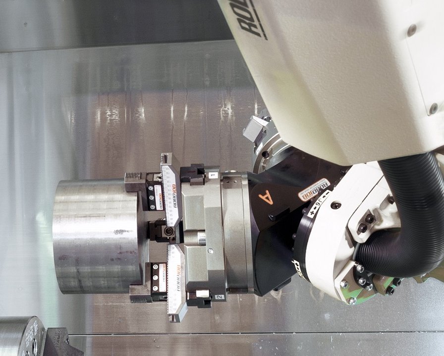a robojob cnc automation system loading a cnc machine